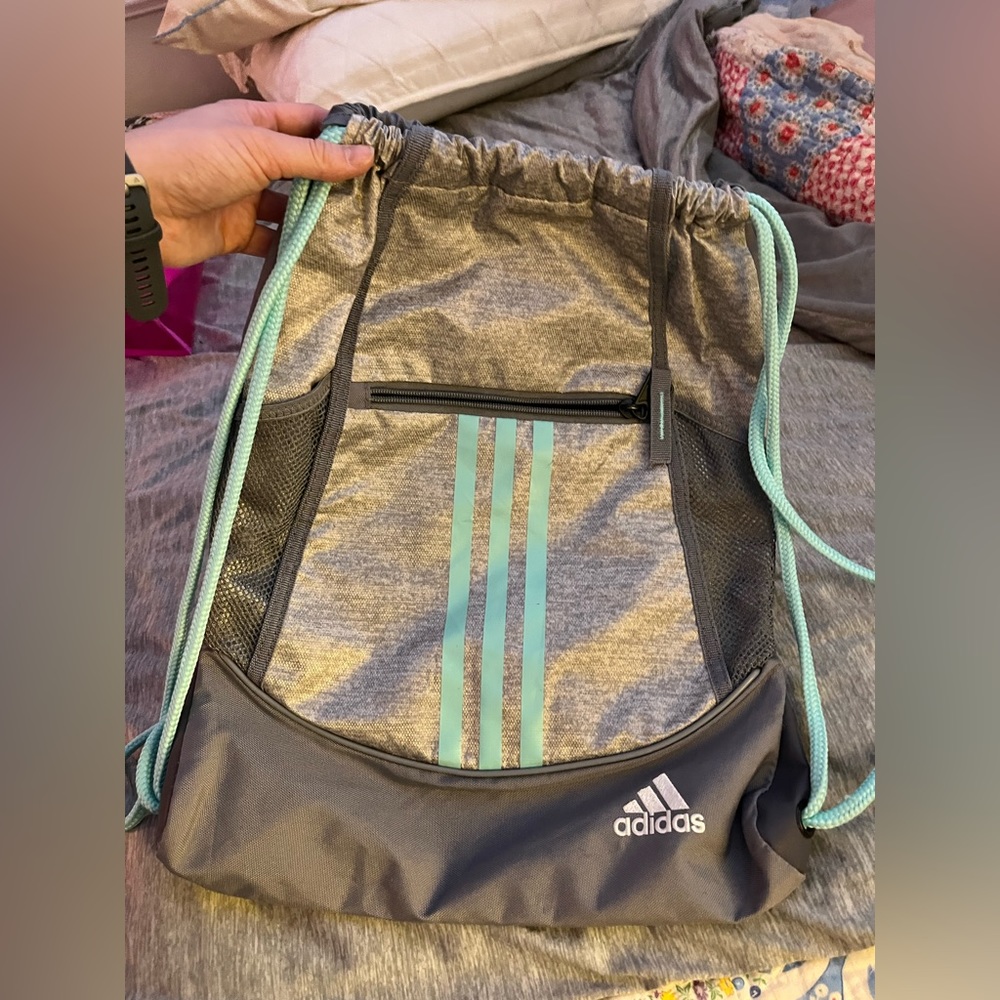 two drawstring bags one is Adidas the other is athleta girl